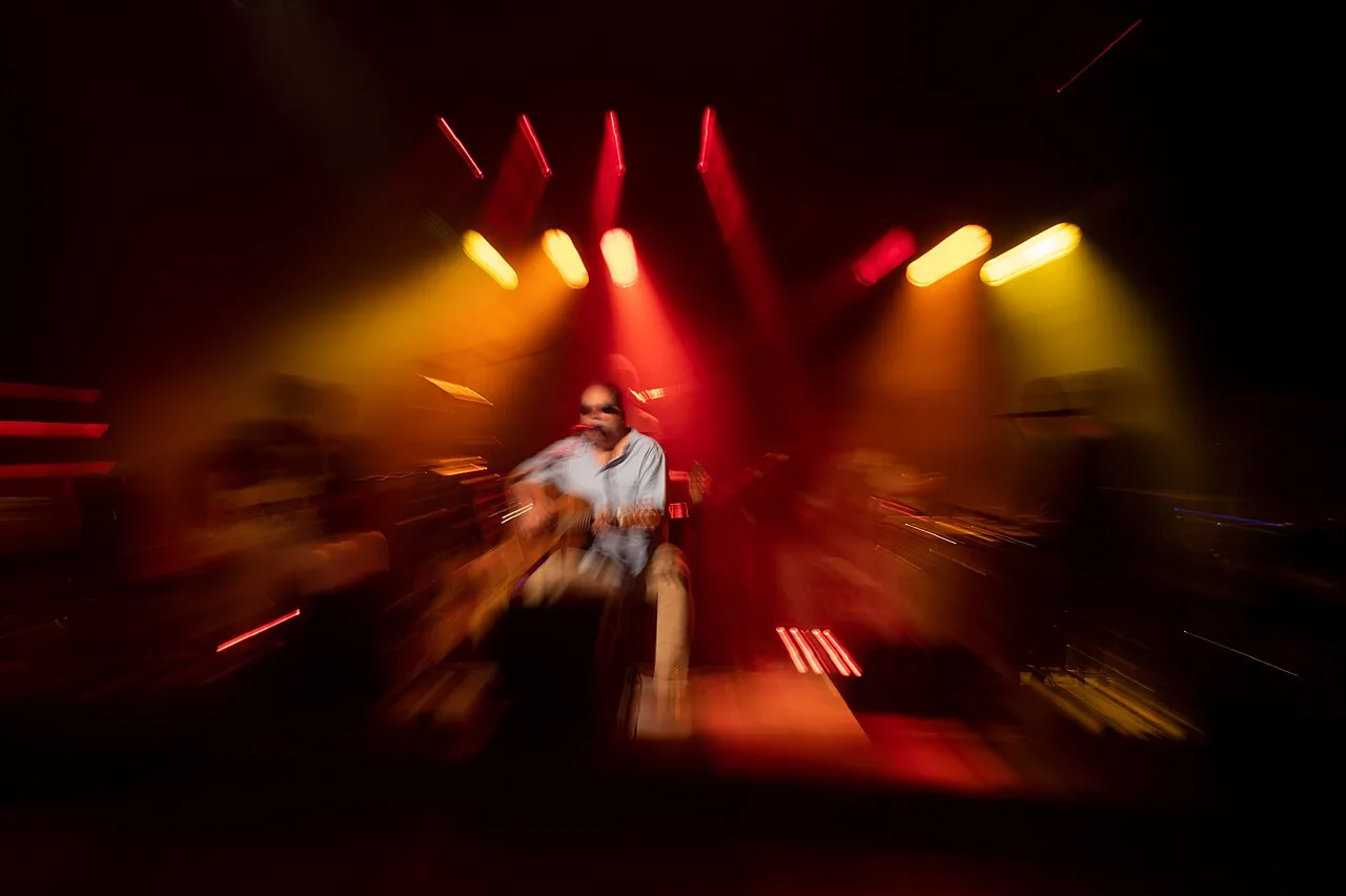 A concert production prepared for a live stream beneath stage lights